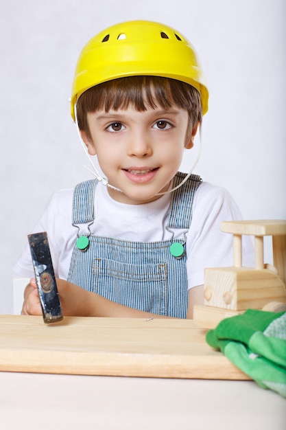 Six years old boy with tool set. Closeup