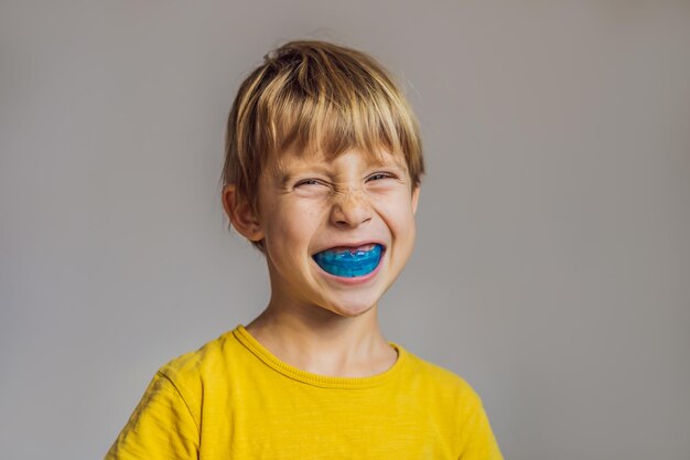 Sixyear old boy shows myofunctional trainer Helps equalize the growing teeth and correct bite develop mouth breathing habit Corrects the position of the tongue