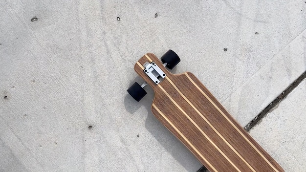 Skateboard on concrete surface top view