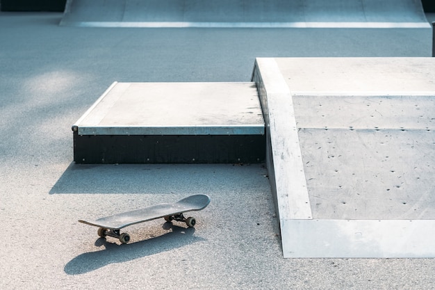 Photo skateboard in skate park. extreme sports subculture. urban lifestyle and adrenaline.