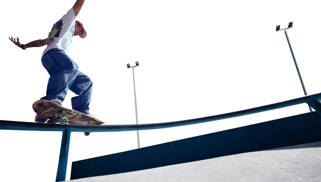 Skateboarder doing a trick isolated on white