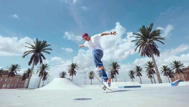 Skateboarder doing a trick in a skate park