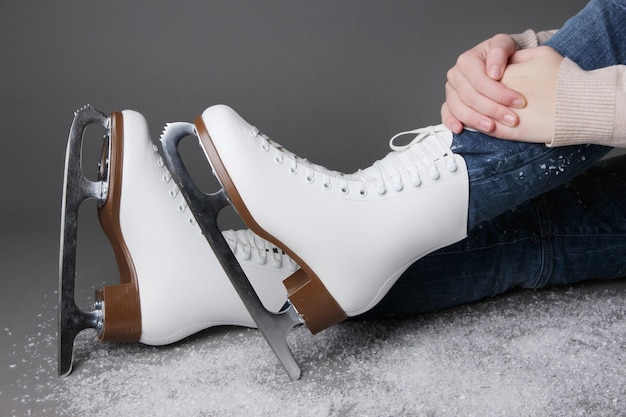 Skater wearing skates on gray background