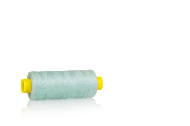 Skein of thread green colors macro on a white background