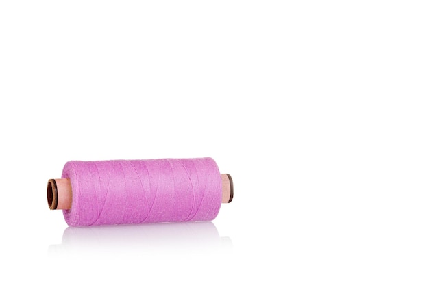 Skein of thread pink colors macro on a white background