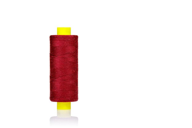 Skein of thread red colors macro on a white background