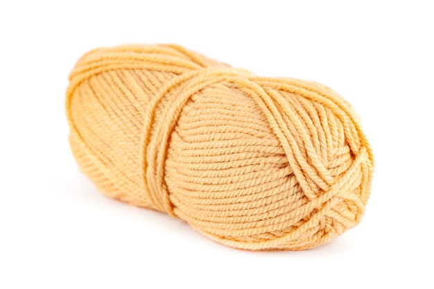 Skein of yellow woolen yarn isolated object