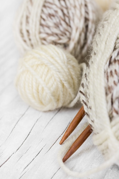 Skeins of wool and wooden knitting needles