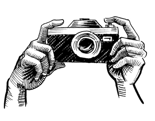 A sketch of hands holding a camera