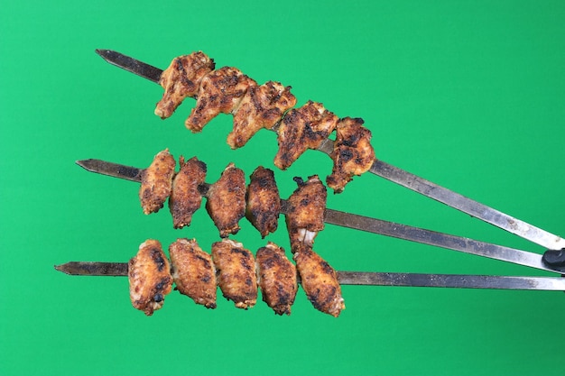 Skewered Grilled Chicken Kababs Isolated on Green Screen Chroma Key Stock Photos