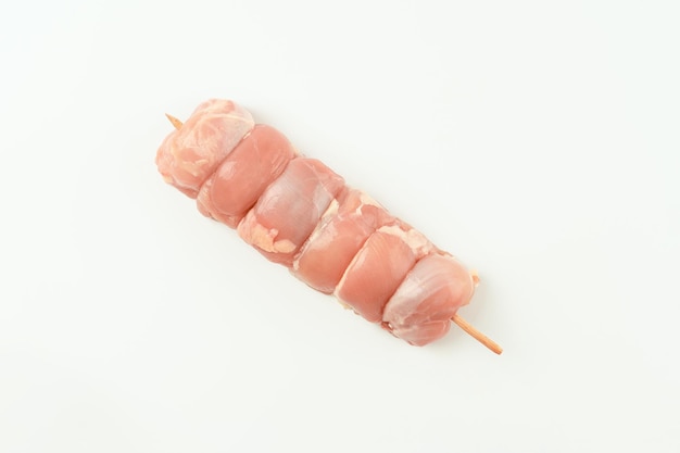 Skewers from raw chicken leg meat without skin for a supermarket on a white backgroundfood for retai