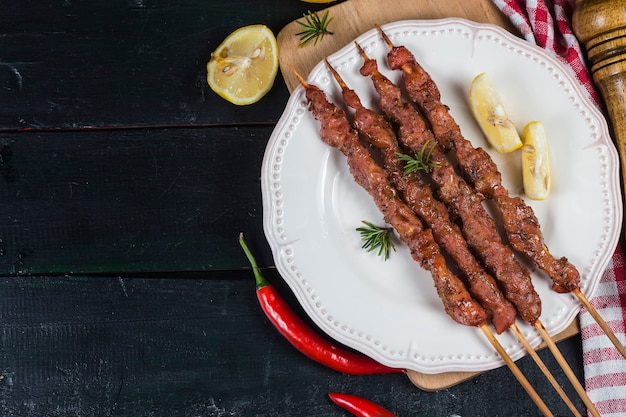 Skewers shashlik kebab with red sauce