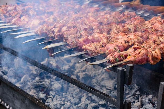 Skewers with meat over the charcoals Cooking shashlik