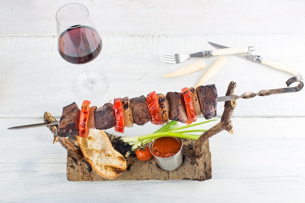 Skewers on a wooden background