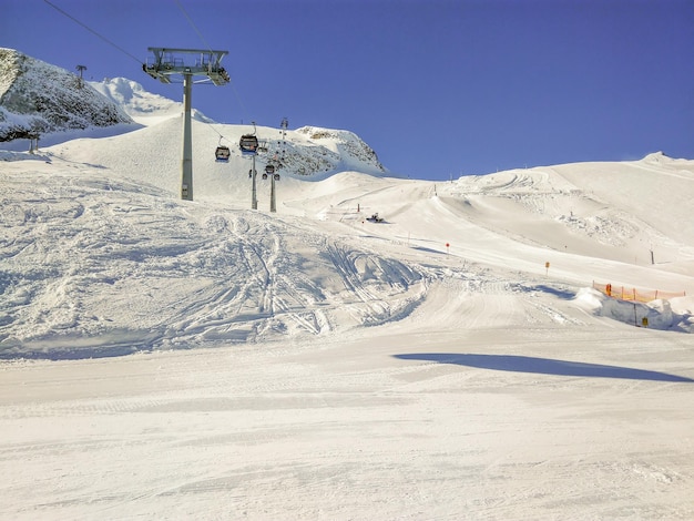 Ski lift on snow covered landscape