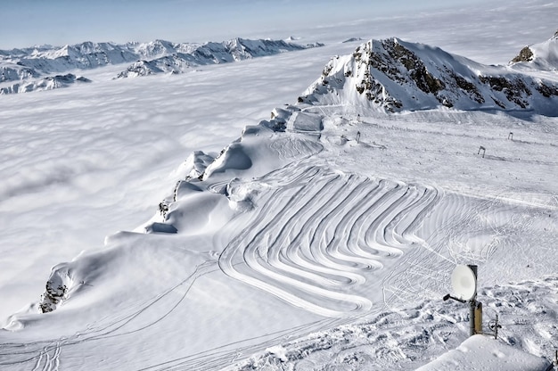 Ski resort in the alps ski slopes piste powder snow in the mountains