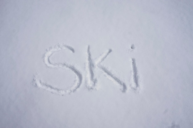 Ski word written in a cold snow background