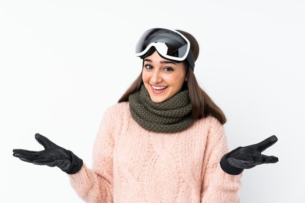 Photo skier girl with snowboarding glasses with shocked facial expression