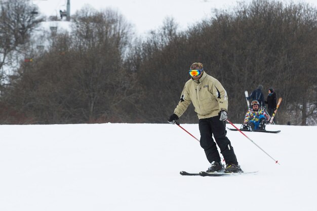 A Skier Slowly Descends The Ski Slope