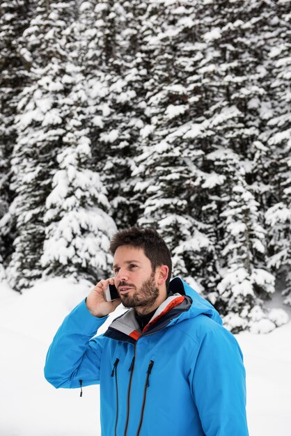 Skier talking on mobile phone