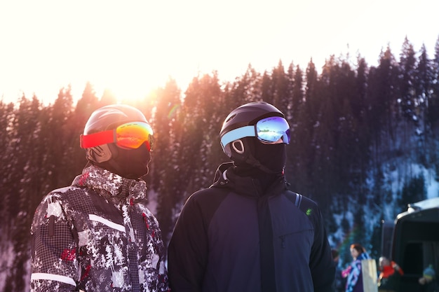 Skiers in goggles and ski helmets outdoor