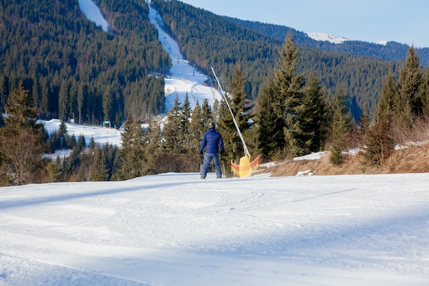 Skiing people and the chair lifts of ski region in Ukraine.