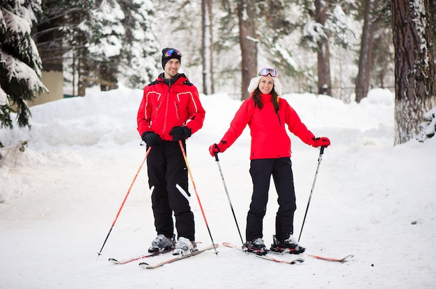 Skiing, snow, winter fun, happy family is skiing in the forest.