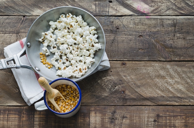 Skillet with corn popcorn. Top view.