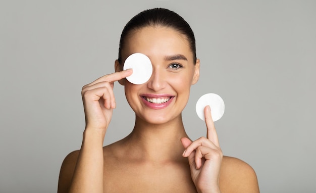 Skin Care Girl Removing Makeup with Cotton Pads