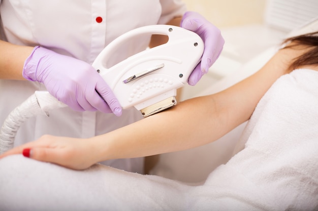 Skin care. Hands Laser epilation and cosmetology. Hair removal cosmetology procedure