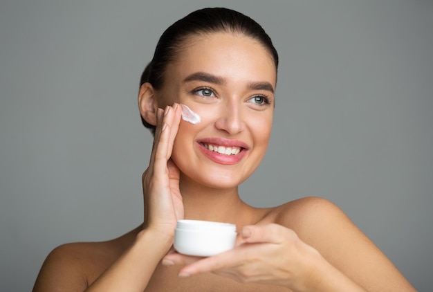 Skin Care Woman Applying Anti Aging Cream