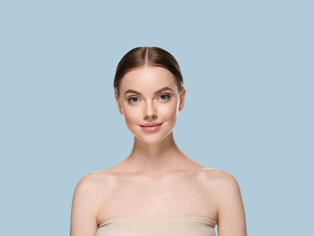 Skin care woman face with healthy beauty skin closeup cosmetic age concept. Color background blue