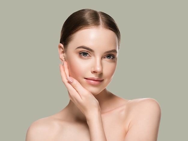 Skin care woman with hands portrait  skin closeup cosmetic age concept. Color background green