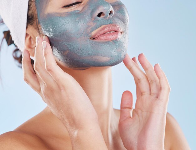 Skincare facial and beauty with woman with face mask for cosmetics luxury relax or acne against blue background studio Salon product and dermatology for wellness spa and treatment