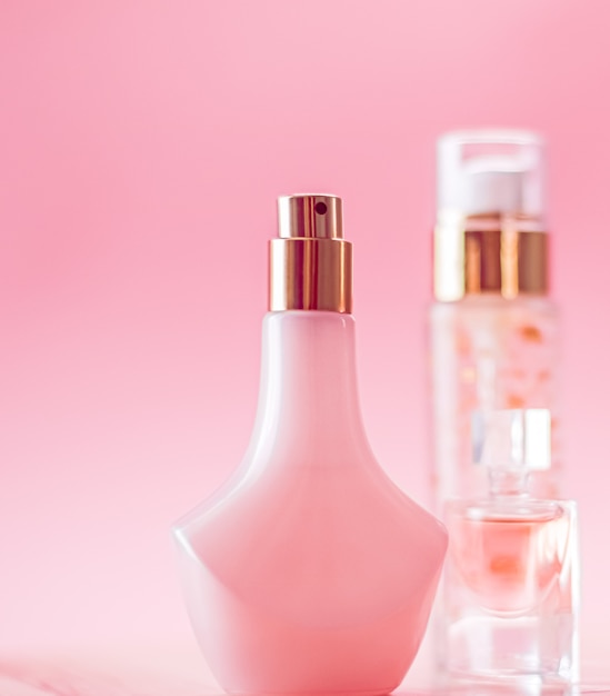 Skincare perfume and makeup set on pink background luxury beauty and cosmetic products