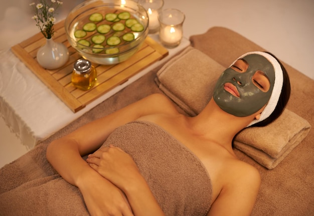 skincare relax and woman with face mask at spa for detox smooth skin and cosmetic wellness luxury hotel sleep and female person with beauty product for dermatology collagen and natural facial