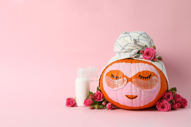 Skincare supplies, pumpkin with eye patches and towel