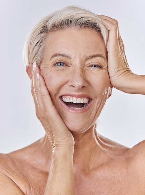 Skincare wrinkles and face of old woman or model in beauty cosmetics or flawless skin portrait isolated on studio background Big smile senior lady posing with anti aging skin care wellness routine