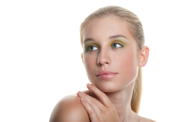 Skincare of young beautiful woman face with long blond hair over white background