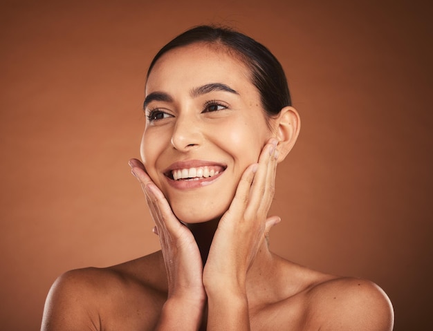 skincare young woman face and cosmetics with natural beauty wellness and brown studio background makeup body care and confident female smile for organic facial touch smooth skin and healthy