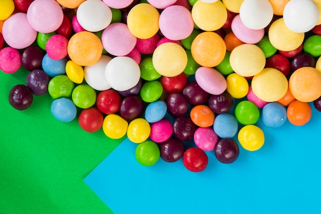 Skittles candy on the colorful table colorful sweet candy