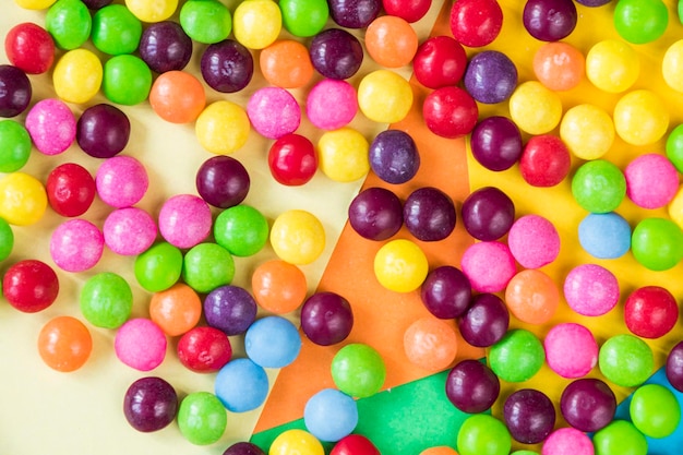 Skittles candy on the colorful table colorful sweet candy