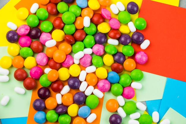 Skittles candy on the colorful table colorful sweet candy