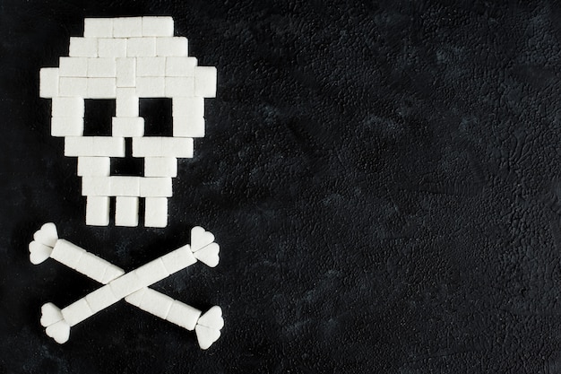 the skull made of sugar cubes. sugar kills.