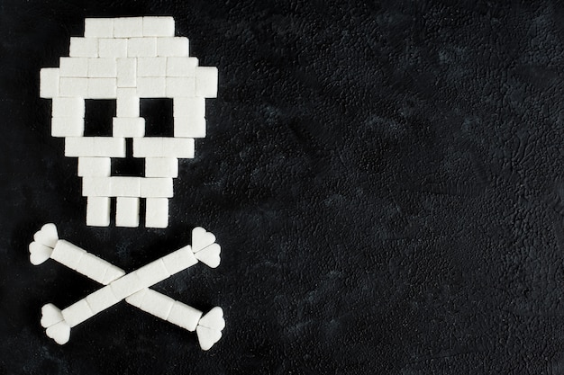 Photo the skull made of sugar cubes. sugar kills.