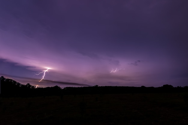 Sky background and lightning bolt at night