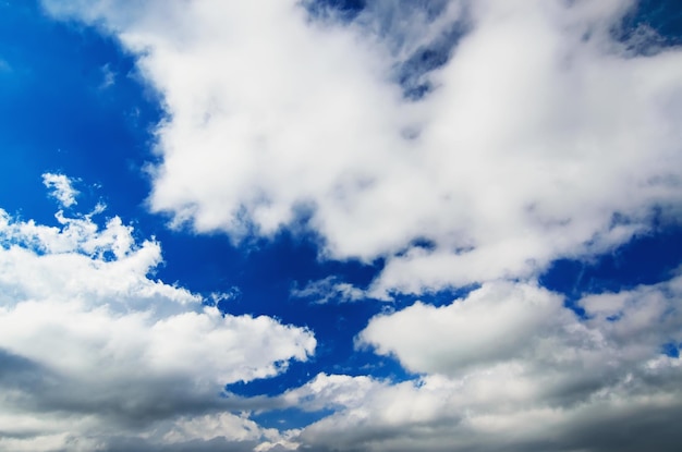 Sky background with the fluffy white clouds