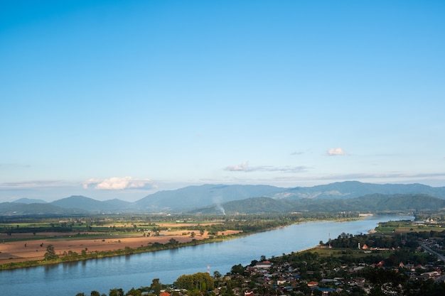 The sky has clouds and the Mekong River.sky and cloud.white clouds.Village near the river.Border river.River border Thailand and Laos.