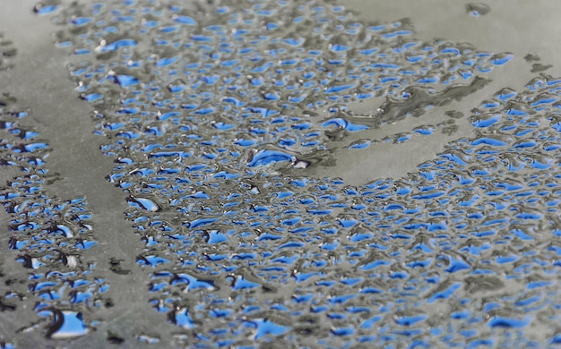 Sky reflected in drops of dew. Natural background