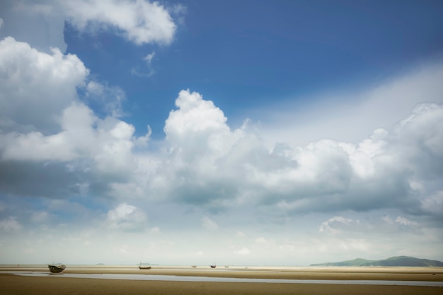 Sky and Small wooden fishing boat on the coast